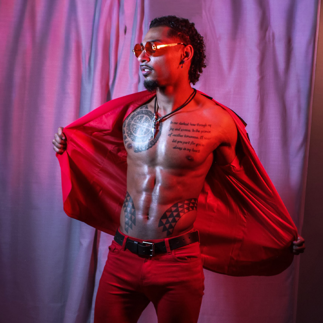 Arrow performing on stage at EXXXOTICA