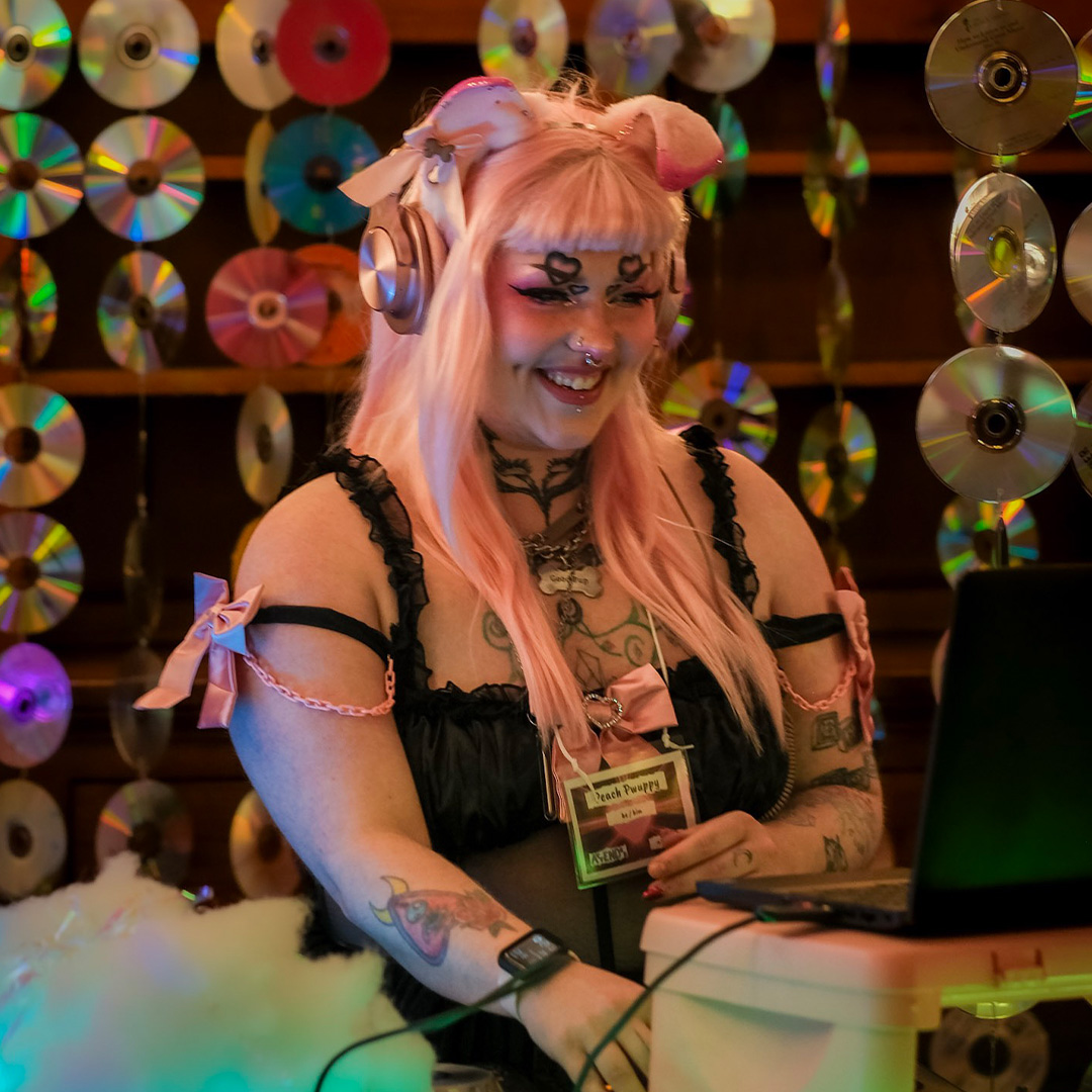 DJ Peach Pwuppy performing on stage at EXXXOTICA