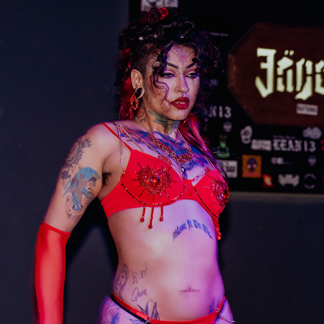 Sin Fierno performing on stage at EXXXOTICA
