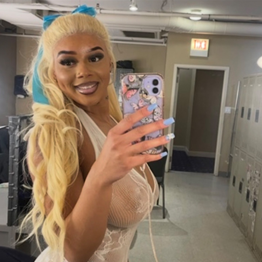Benji taking a mirror selfie in a backstage hallway