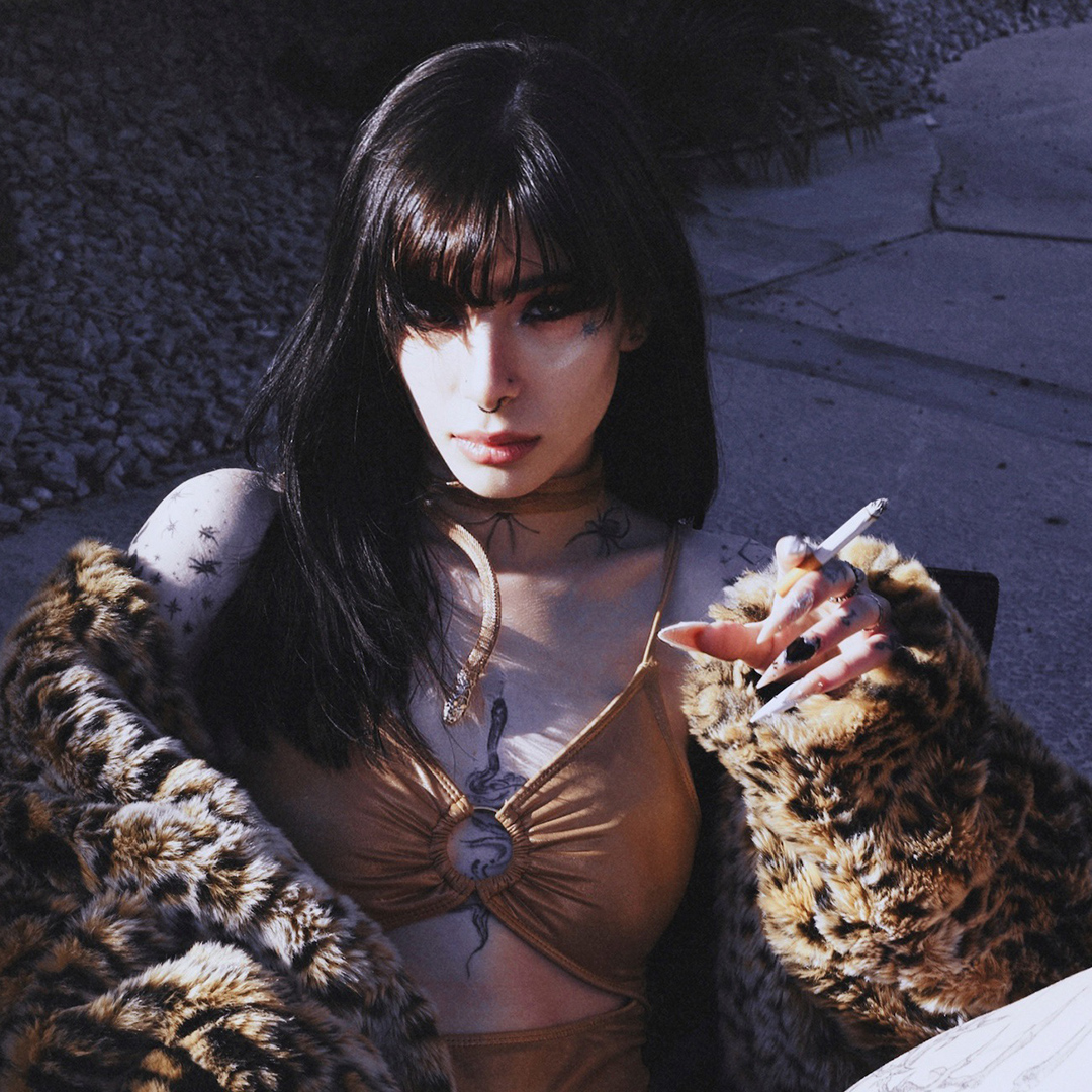 Silk Shadows in a fur coat holding a cigarette outdoors